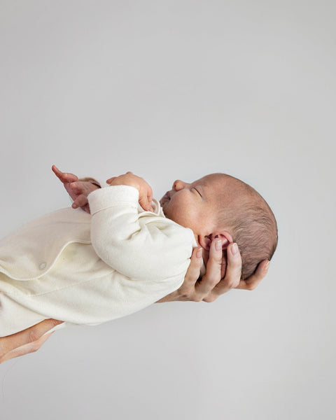 newborn suit with snaps in cream